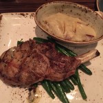 Bone-in pork chops with mashed potatoes and green beans