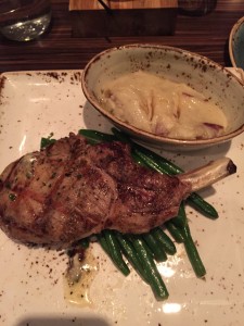 Bone-in pork chops with mashed potatoes and green beans