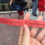 Attendees gather for "ribbon-chewing" by Cause for Paws rescue dog at The Lincoln Apartments