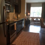 Staged one-bedroom unit kitchen at The Lincoln Apartments